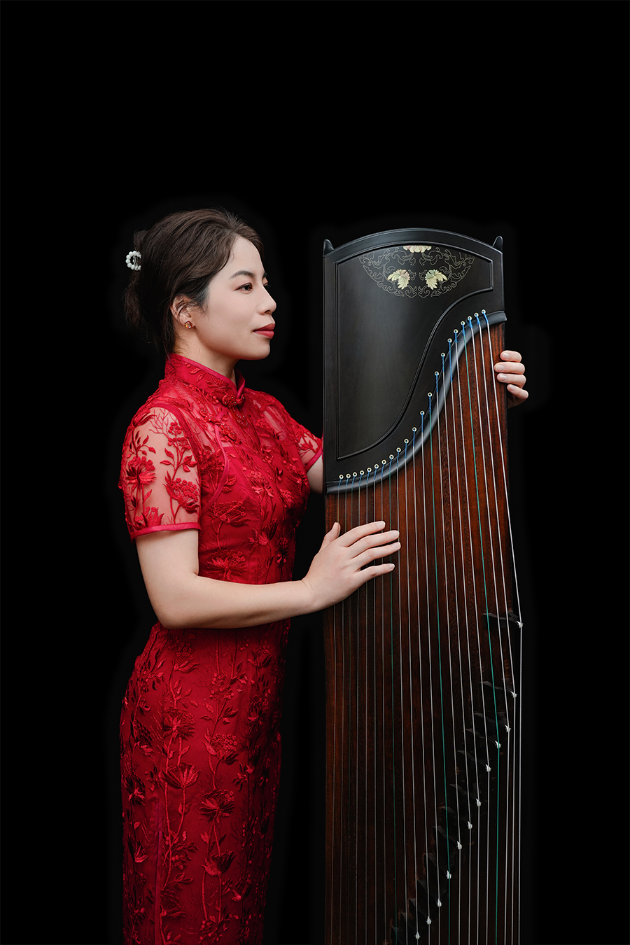 A harpist plays music on a harp